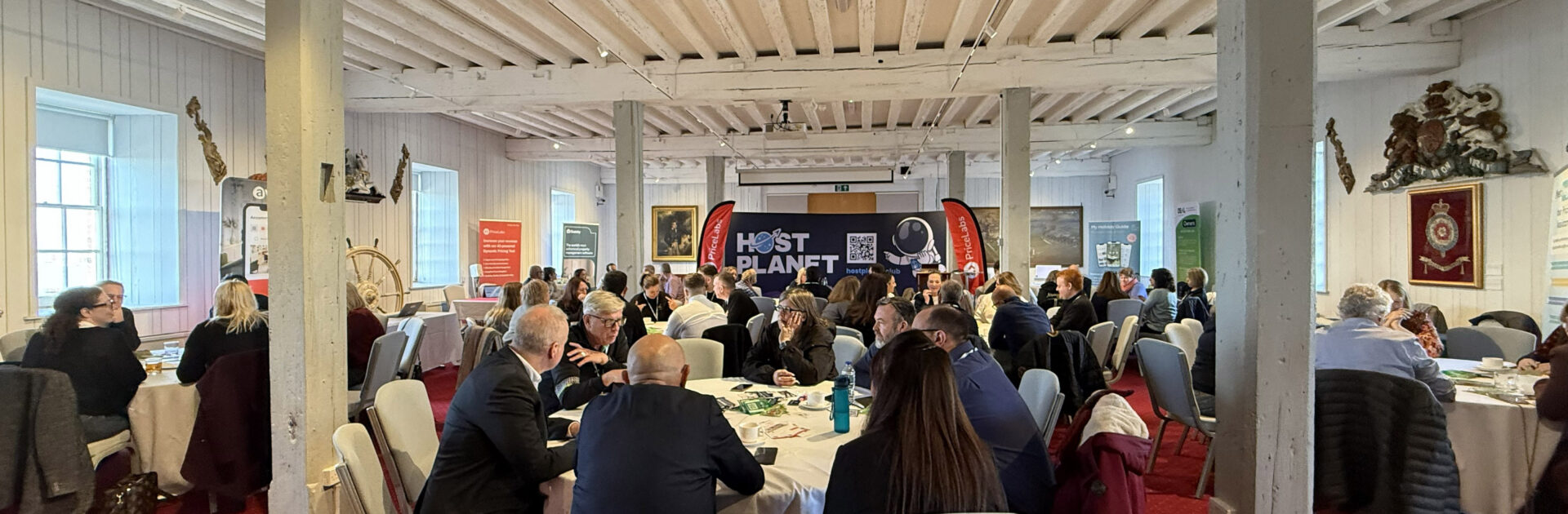 The Island Holiday Company team discussing Isle of Wight property management at the Host Planet Roadshow.