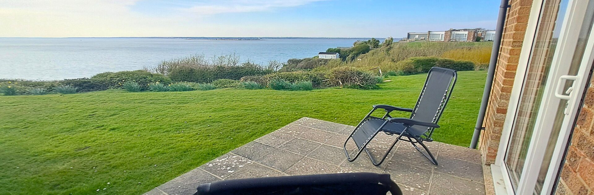 Brambles Farm Bungalow in Freshwater offering stunning sea views and classic Isle of Wight things to do in July.