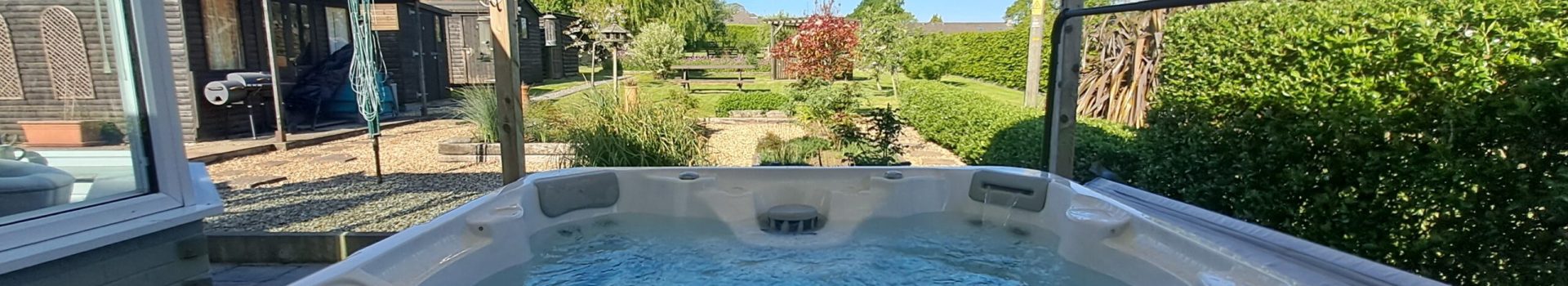 Luxury Isle of Wight winter holiday cottage with private hot tub, cosy interiors, and scenic surroundings, available with The Island Holiday Company