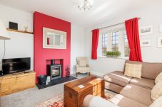 Old Abbey Farmhouse lounge with log burner and countryside views