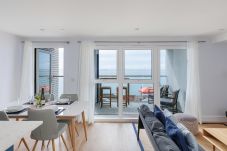 Modern living area with comfortable seating at Culver Sands holiday apartment.