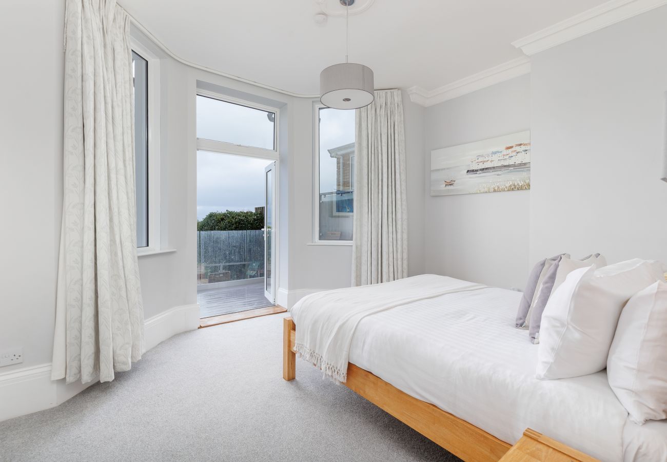 Double Bedroom at Cowes Garden Apartment with sea and garden views and balcony doors
