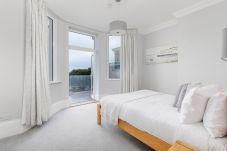 Double Bedroom at Cowes Garden Apartment with sea and garden views and balcony doors