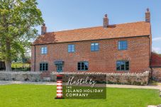 Exterior of The Farmhouse at Nunwell, a spacious renovated farmhouse on the Isle of Wight