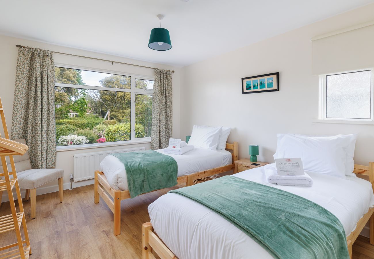 Comfortable twin bedroom in coastal holiday accommodation