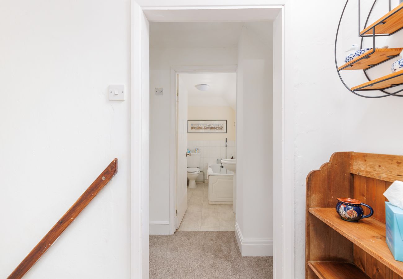 Hallway leading towards the bathroom at Moon Chine Cottage on the Isle of Wight.