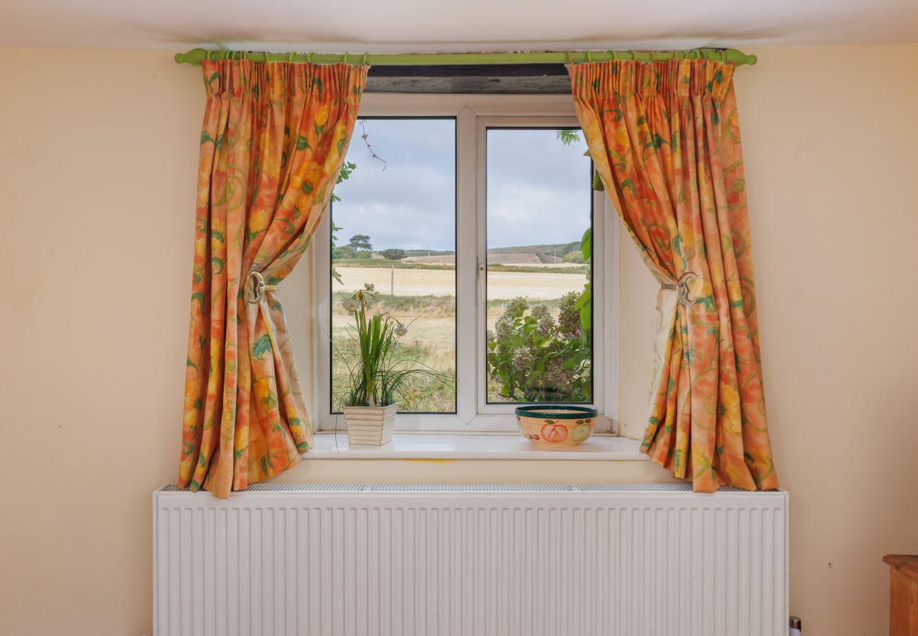 Living room window overlooking the countryside at Moon Chine Cottage on the Isle of Wight.