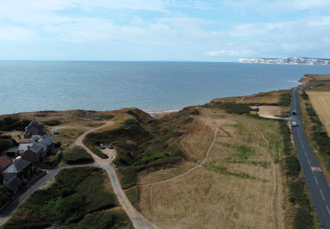 Aerial view of Moon Chine Cottage, parking area, coastline and Military Road on the Isle of Wight.