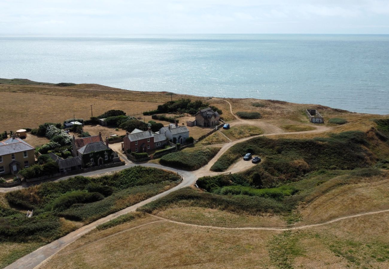 Aerial view of Moon Chine Cottage and its private parking area on the Isle of Wight.