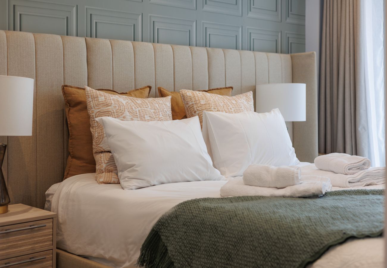 Comfortable super king-size bed in the master bedroom at Hummingbird, Sandown.