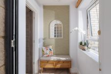 Welcoming entrance hallway leading into Hummingbird, a ground-floor apartment on Sandown seafront.