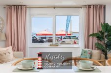 Breakfast bar with views through the window at Hummingbird ground-floor apartment on Sandown seafront.